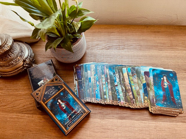 Box Set Limited Edition of the Mystical Tarot of the Saints. Premium gift containing gold edges linen tarot cards, altar cloth, art prints